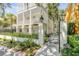 Home exterior featuring a walkway, black fence, and lush landscaping at 106 W Shipyard Rd, Mount Pleasant, SC 29464