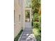 Home's side exterior, showcasing stairs, a walkway, and landscaping at 106 W Shipyard Rd, Mount Pleasant, SC 29464
