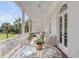 Covered porch with seating area and beautiful water views at 106 W Shipyard Rd, Mount Pleasant, SC 29464
