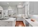 Elegant white kitchen with an island and stainless steel appliances at 106 W Shipyard Rd, Mount Pleasant, SC 29464