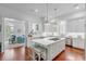 Modern white kitchen with large island and stainless steel appliances at 106 W Shipyard Rd, Mount Pleasant, SC 29464