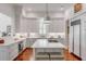 Bright kitchen featuring white cabinets and a spacious island at 106 W Shipyard Rd, Mount Pleasant, SC 29464