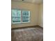 Bright bedroom with plush carpeting and large windows at 217 Cache Ct # 9, Charleston, SC 29414