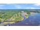 Aerial view of a waterfront community with serene marsh at Lot 93 Lady Banks Ln, Hollywood, SC 29470