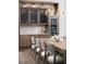 Modern dining area with wine cooler and custom cabinetry at Lot 93 Lady Banks Ln, Hollywood, SC 29470