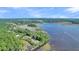 Aerial view showcasing waterfront homes and lush marsh at Lot 93 Lady Banks Ln, Hollywood, SC 29470