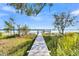 Long wooden dock leading to a waterfront pier at Lot 93 Lady Banks Ln, Hollywood, SC 29470