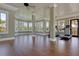 Bright home gym with wood floors, large windows, and modern workout equipment at Lot 93 Lady Banks Ln, Hollywood, SC 29470