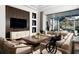 Spacious living area with a large sectional and access to a screened patio at Lot 93 Lady Banks Ln, Hollywood, SC 29470