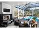 Indoor lounge area with fireplace and view of the pool at Lot 93 Lady Banks Ln, Hollywood, SC 29470