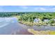 Aerial view of a luxurious waterfront home and dock at Lot 93 Lady Banks Ln, Hollywood, SC 29470