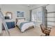 Bright bedroom with comfy bed and built-in shelving at 9844 Haven Loop, Johns Island, SC 29455