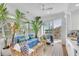 Sunroom with wicker furniture, tropical plants, and stunning water views at 9844 Haven Loop, Johns Island, SC 29455