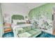 Serene bedroom with green velvet accents and crane wallpaper at 9844 Haven Loop, Johns Island, SC 29455