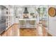 Modern kitchen with white cabinets, stainless steel appliances, and an island at 9844 Haven Loop, Johns Island, SC 29455