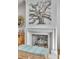 Modern fireplace with brick surround and unique art installation above at 9844 Haven Loop, Johns Island, SC 29455