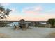 Relaxing fire pit area with wooden chairs, overlooking the marsh at 9844 Haven Loop, Johns Island, SC 29455