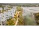Aerial view of homes near waterfront with marsh views at 9844 Haven Loop, Johns Island, SC 29455