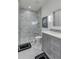 Spa-like bathroom with marble shower and gray vanity at 9844 Haven Loop, Johns Island, SC 29455