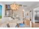 Bright dining area with round table, stylish seating and a statement chandelier at 9844 Haven Loop, Johns Island, SC 29455