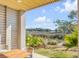 Relaxing patio with wooden table and chairs, offering scenic marsh views at 9844 Haven Loop, Johns Island, SC 29455