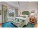 Peaceful bedroom with green velvet furniture and water views at 9844 Haven Loop, Johns Island, SC 29455