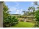 Tranquil backyard with lush greenery and peaceful marsh views at 9844 Haven Loop, Johns Island, SC 29455