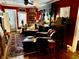 Red-walled living room with leather seating, ornate bar, and wood floors at 106 Church St, Reevesville, SC 29471