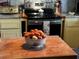 Bowl of brown and white eggs on butcher block counter, near stove at 106 Church St, Reevesville, SC 29471