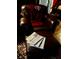 Leather chair with ottoman, red blanket, and newspapers at 106 Church St, Reevesville, SC 29471