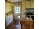 Bright kitchen with butcher block island, farmhouse sink, and granite counters at 106 Church St, Reevesville, SC 29471