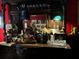 Ornate wooden bar with liquor, glassware, and decorative items at 106 Church St, Reevesville, SC 29471