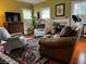 Spacious living room featuring hardwood floors, comfortable seating, and a fireplace at 106 Church St, Reevesville, SC 29471