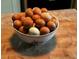Bowl of brown and white eggs on butcher block counter at 106 Church St, Reevesville, SC 29471