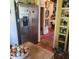 Kitchen with stainless steel refrigerator and hardwood floors at 106 Church St, Reevesville, SC 29471