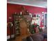 Charming living room features antique furniture and rich red walls at 106 Church St, Reevesville, SC 29471