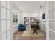 Bright home office featuring built-in shelving and a comfortable armchair at 1691 Cultivation Lane Way # 462, Mount Pleasant, SC 29466
