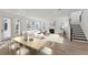 Light and airy dining area with a wooden table and four chairs at 1691 Cultivation Lane Way # 462, Mount Pleasant, SC 29466