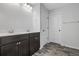 Bathroom with dark brown double vanity and vinyl flooring at 173 Cantona Dr, Summerville, SC 29483