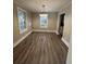 Spacious dining area with hardwood floors and elegant chandelier at 7629 Pinehurst St, North Charleston, SC 29420