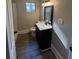 Clean bathroom with vanity, toilet, and shower at 7629 Pinehurst St, North Charleston, SC 29420