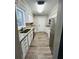 Renovated kitchen with granite countertops and stainless steel appliances at 7629 Pinehurst St, North Charleston, SC 29420