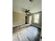 Spacious bedroom with ceiling fan, large closet, and wood-look flooring at 7629 Pinehurst St, North Charleston, SC 29420