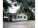 Charming ranch home with a screened porch and well-maintained landscaping at 7629 Pinehurst St, North Charleston, SC 29420