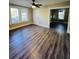Bright and airy living room with hardwood floors and ceiling fan at 7629 Pinehurst St, North Charleston, SC 29420
