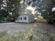 Side view of the house showcasing the ample backyard space at 7629 Pinehurst St, North Charleston, SC 29420