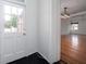 Entryway with exterior door and view into living room at 106 Church St # D, Charleston, SC 29401