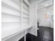 White kitchen pantry with built-in shelves at 106 Church St # D, Charleston, SC 29401