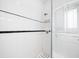 White tiled shower with black accents and window with shutters at 106 Church St # D, Charleston, SC 29401
