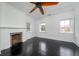 Bright bedroom with fireplace, dark hardwood floors, and multiple windows at 106 Church St # D, Charleston, SC 29401